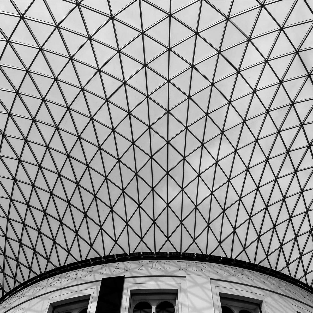 Curving glass and steel lattice roof, black and white
